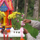 The brahman blesses the spirit house